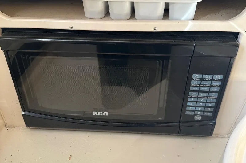 Slide: The Image of RCA microwave inside a 2004 Grady-White Sailfish 282 WA boat kitchen area. - 21