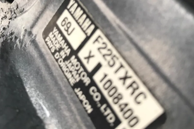 Slide: The Image of Close-up of a Yamaha F225TXRC engine label on a 2004 Grady-White Sailfish 282 WA. - 24