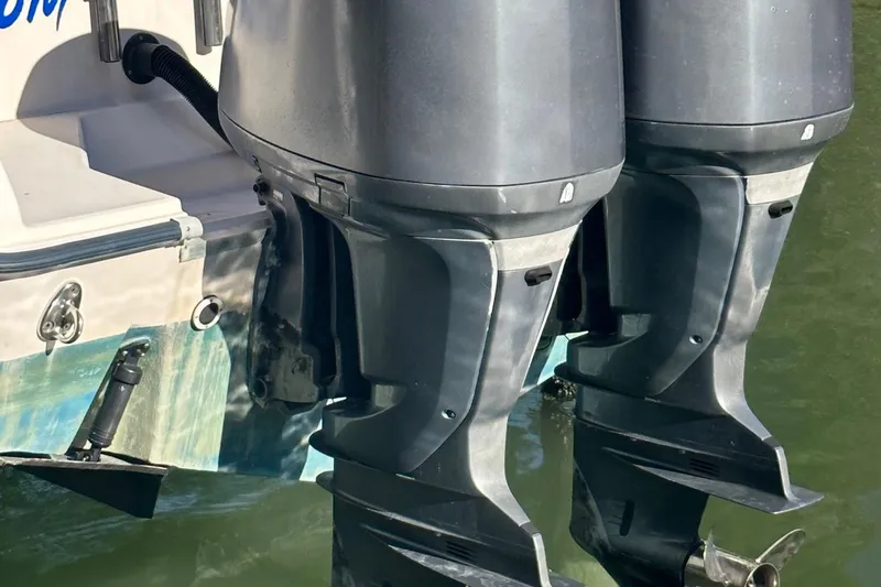 Slide: The Image of Twin outboard motors on a 2004 Grady-White Sailfish 282 WA boat. - 4