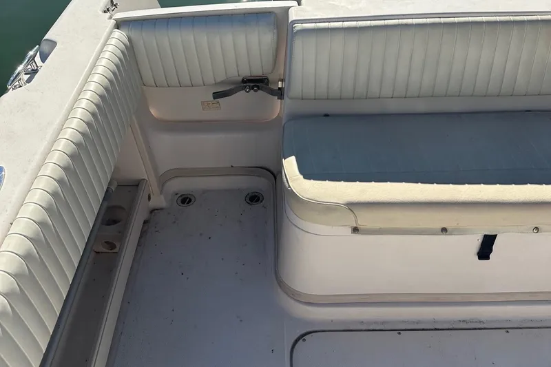 Slide: The Image of 2004 Grady-White Sailfish 282 WA boat interior with cushioned seating. - 9