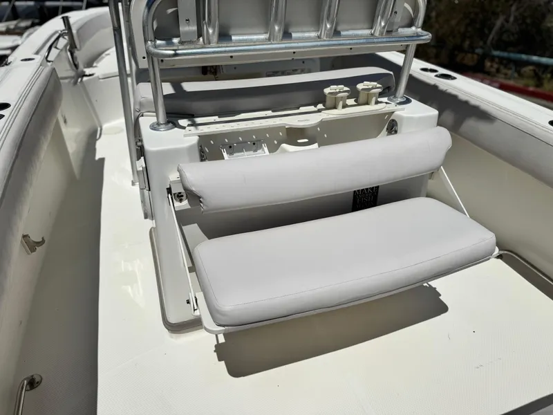 Slide: The Image of 2006 Bayliner 2503 Trophy Center Console boat interior with cushioned seating. - 10