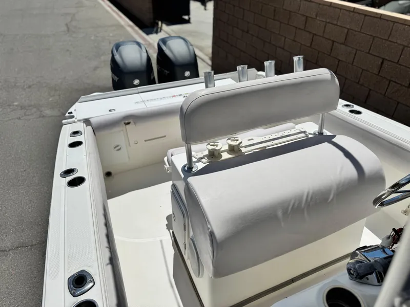 Slide: The Image of 2006 Bayliner 2503 Trophy Center Console boat with dual engines and seating. - 13