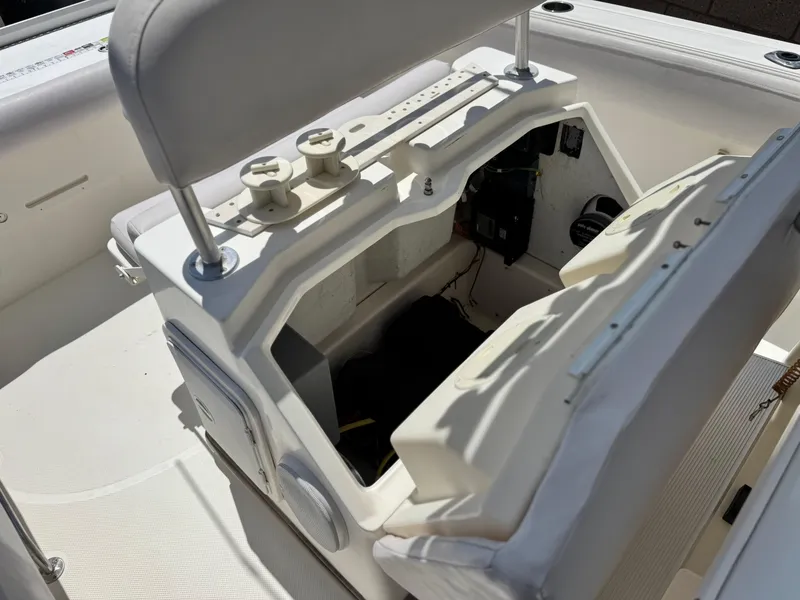 Slide: The Image of 2006 Bayliner 2503 Trophy Center Console interior with open storage compartment. - 21