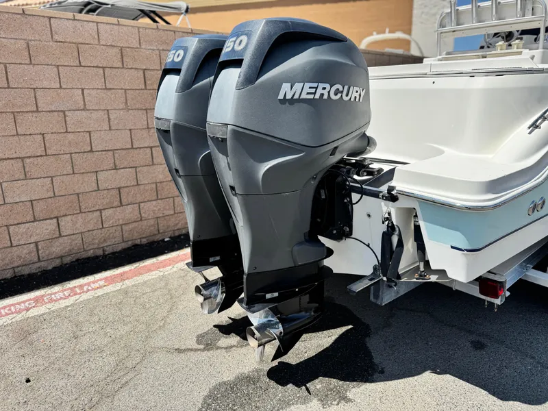 Slide: The Image of Twin Mercury outboard engines on a 2006 Bayliner 2503 Trophy Center Console boat. - 6