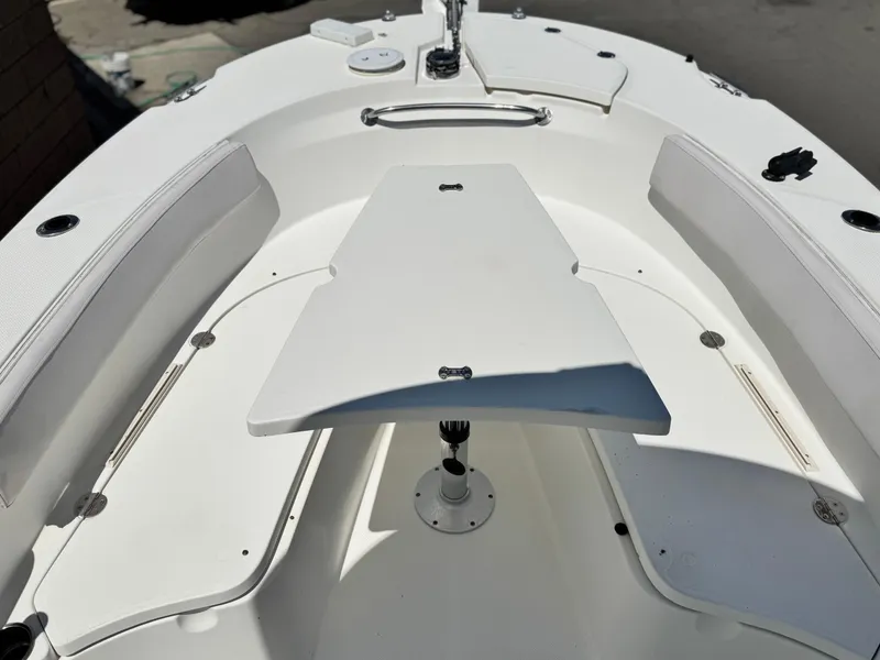 Slide: The Image of 2006 Bayliner 2503 Trophy Center Console boat interior with seating and table. - 9