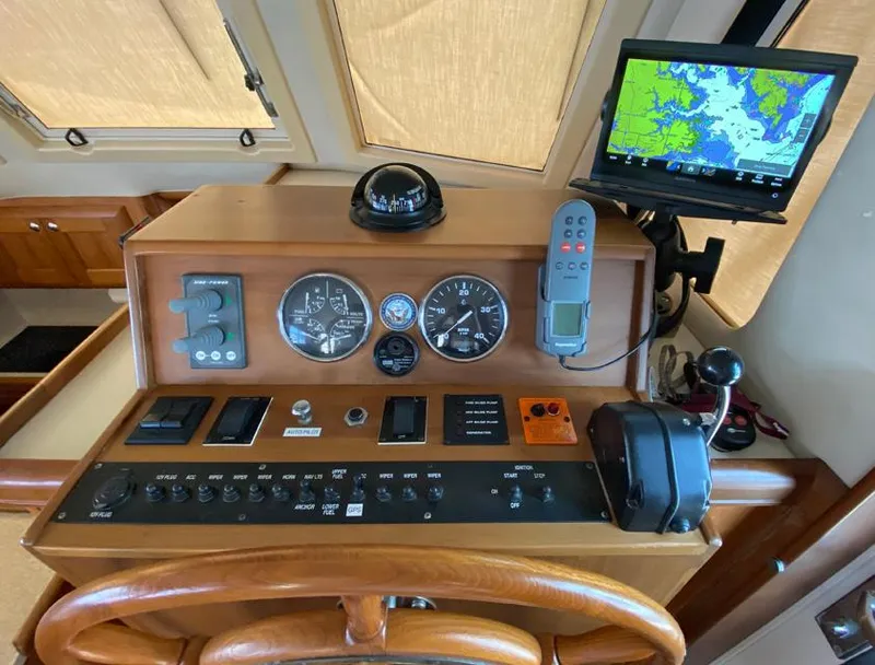Slide: The Image of 2004 Mainship 340 helm with navigation instruments and GPS display. - 14