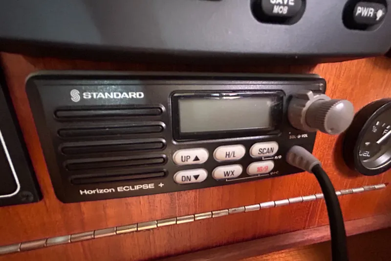 Slide: The Image of Standard Horizon Eclipse+ radio on a 1998 Tartan 3500 yacht dashboard. - 22