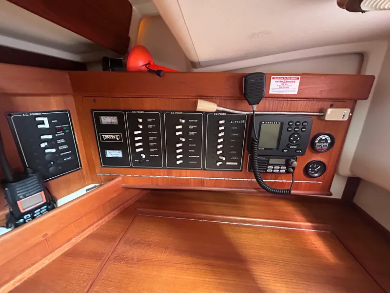 Slide: The Image of Control panel of a 1998 Tartan 3500 sailboat with navigation and communication equipment. - 23