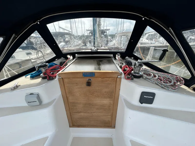 Slide: The Image of Cockpit of 1998 Tartan 3500 sailboat with ropes and winches, docked at marina. - 24