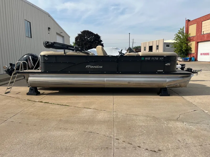 Slide: The Image of 2018 Manitou 23 Oasis RF VP pontoon boat parked on concrete surface. - 17