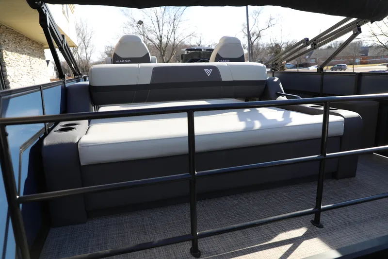Slide: The Image of 2025 Viaggio Lago X22S boat interior with cushioned seating and cup holders. - 13