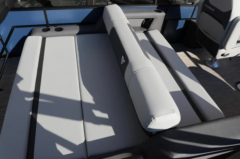 Slide: The Image of 2025 Viaggio Lago X22S boat interior with gray seating and cup holders. - 4