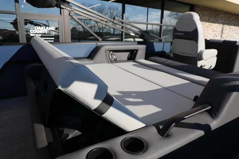 Slide: The Image of Interior of 2025 Viaggio Lago X22S boat with modern seating and cup holders. - 5