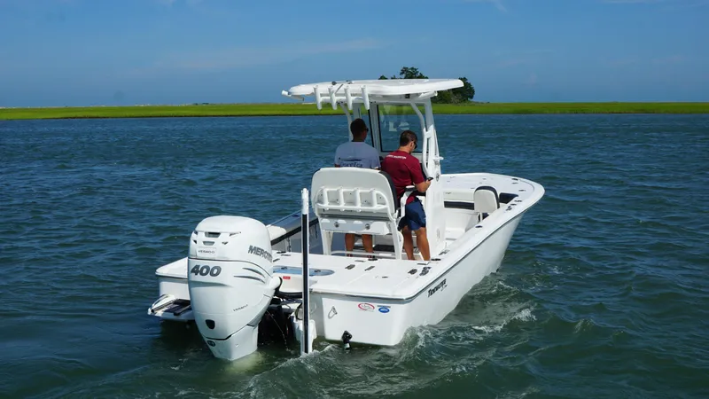 Slide: The Image of 2023 Tidewater 2500CB boat with Mercury 400 engine cruising on open water. - 19
