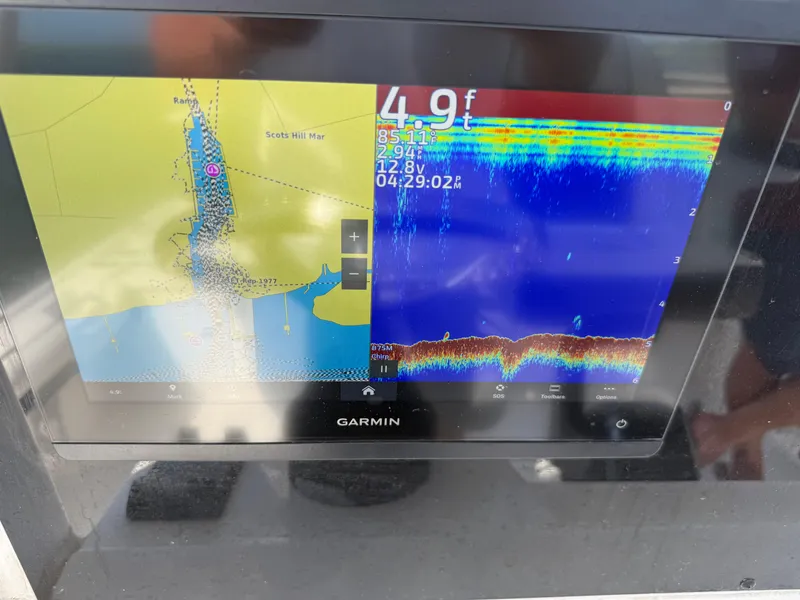 Slide: The Image of Garmin marine display on 2023 Tidewater 2500CB showing navigation and sonar data. - 7