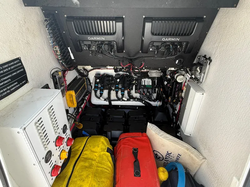 Slide: The Image of Electrical and navigation systems inside a 2017 Onslow Bay 27 boat, featuring Garmin equipment. - 10