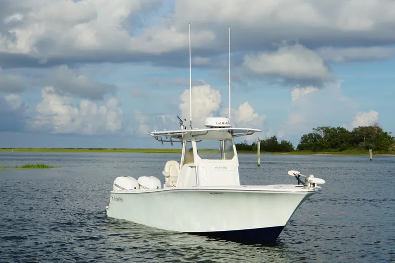 Slide: The Image of 2017 Onslow Bay 27 boat on calm water under cloudy sky. - 14