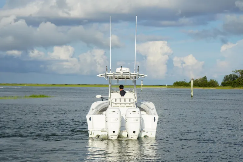 Slide: The Image of 2017 Onslow Bay 27 boat cruising on calm water under cloudy sky. - 17