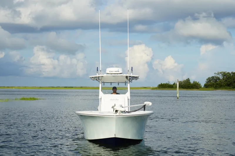 Slide: The Image of 2017 Onslow Bay 27 boat on calm water under cloudy sky. - 18