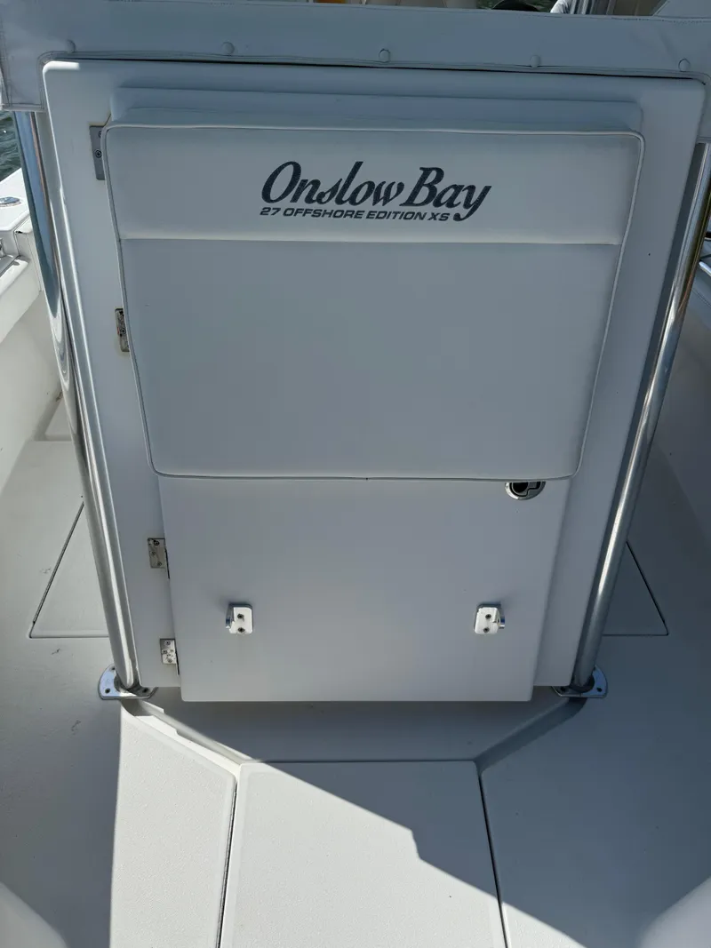 Slide: The Image of 2017 Onslow Bay 27 boat interior with storage compartment. - 5