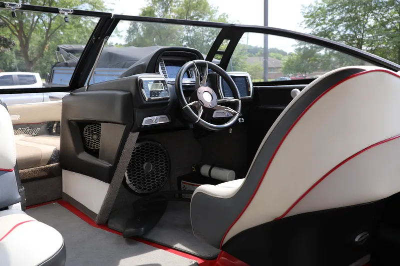 Slide: The Image of 2013 Malibu Wakesetter 20 VTX interior with steering wheel and dashboard, featuring modern design elements. - 4