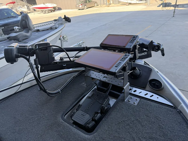 Slide: The Image of 2023 Triton 19 TrX Patriot boat with advanced navigation and control systems. - 17