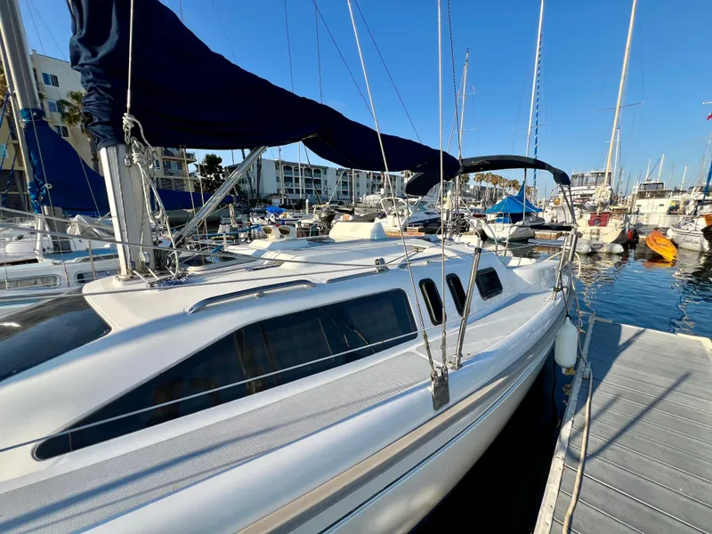 Slide: The Image of Sailboat docked at marina, 1995 Hunter 29.5 model, clear blue sky. - 17