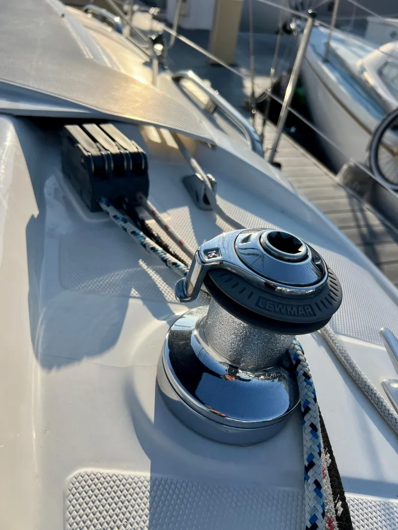 Slide: The Image of Close-up of a 1995 Hunter 29.5 sailboat deck with winch and ropes. - 24