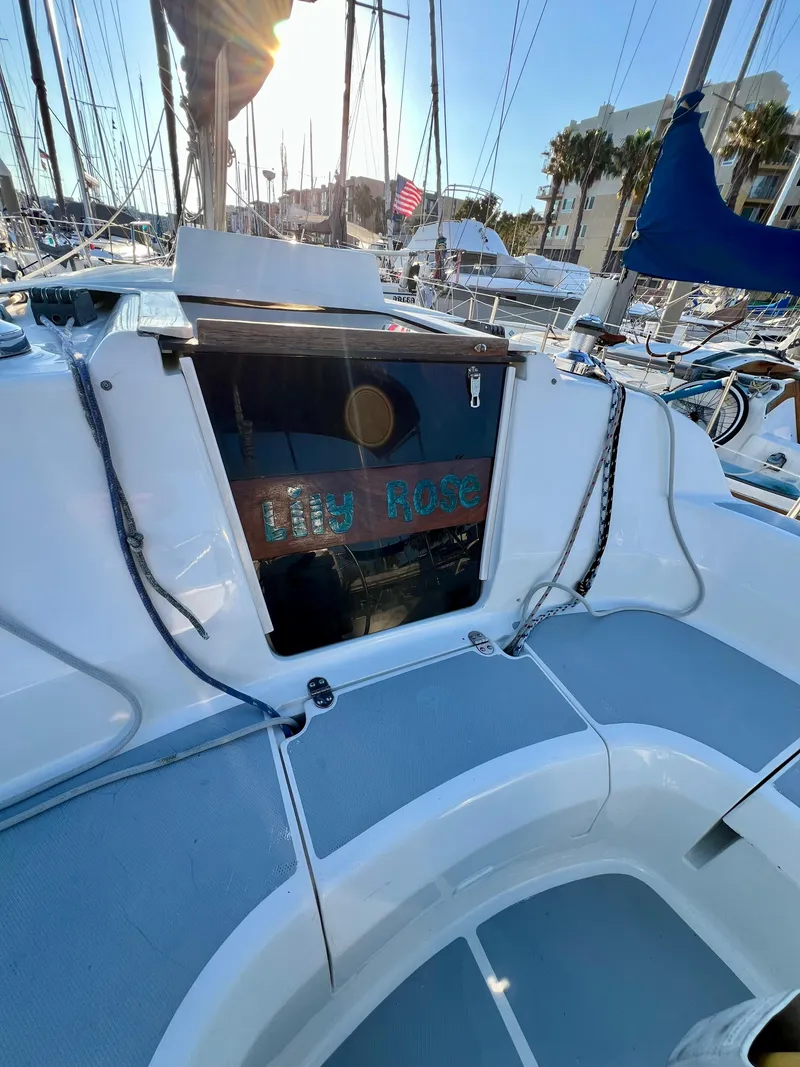 Slide: The Image of Cockpit of 1995 Hunter 29.5 sailboat named "Lily Rose" in marina setting. - 26