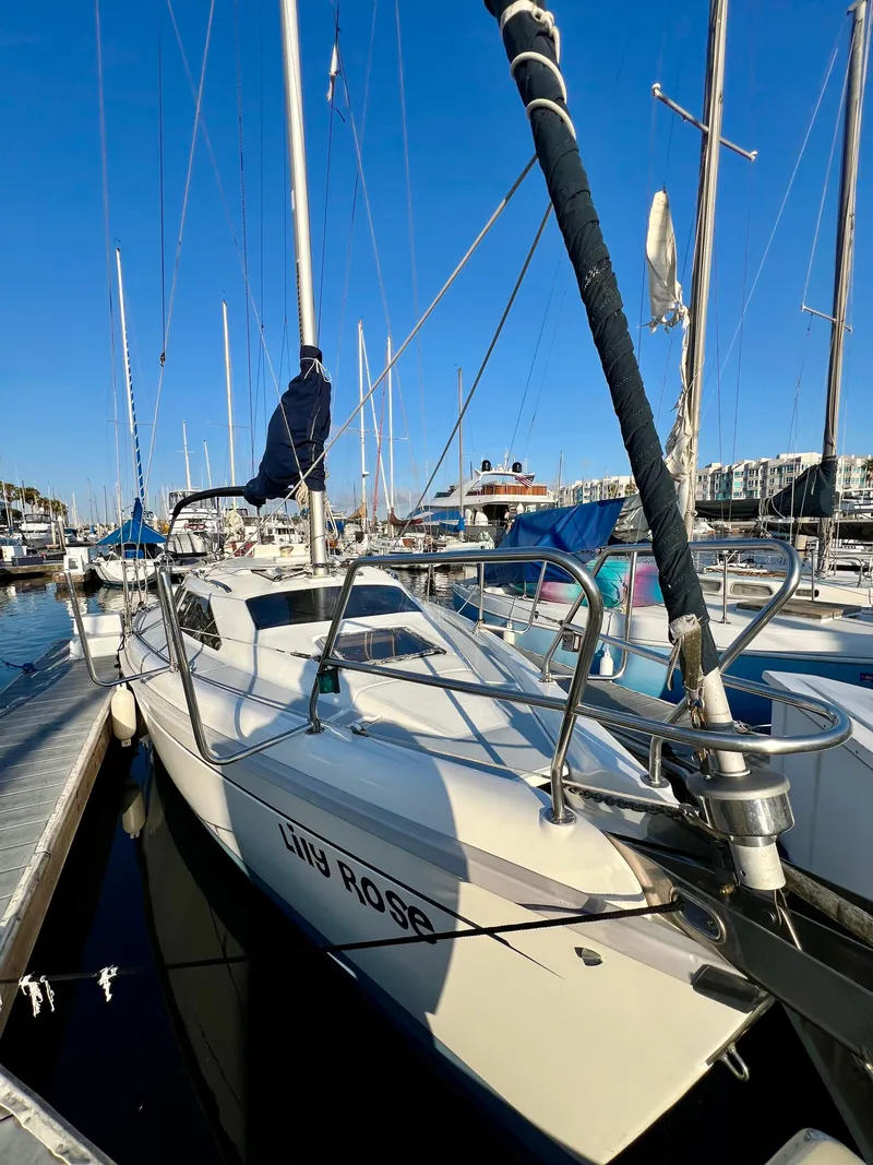 Slide: The Image of Sailboat "Lily Rose" docked, 1995 Hunter 29.5 model, in a marina under clear blue sky. - 5