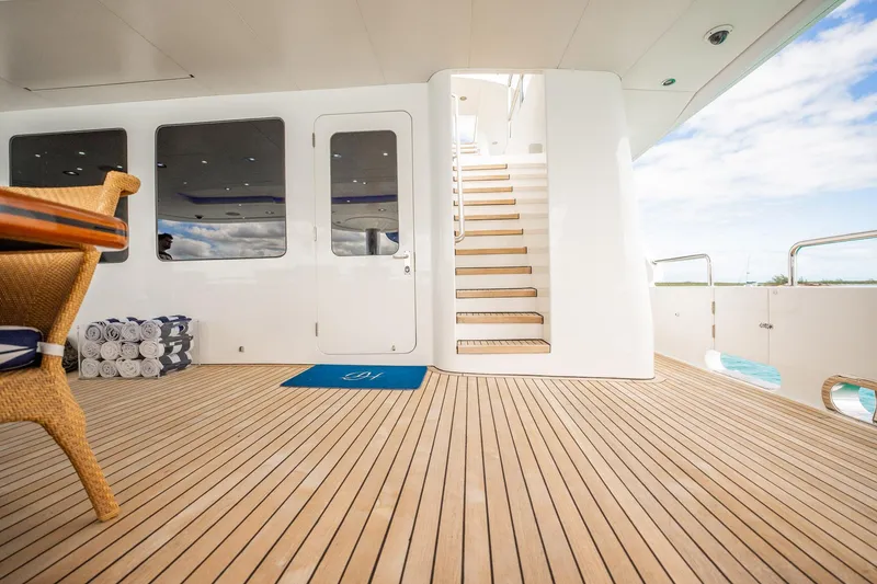 Slide: The Image of Luxurious deck of 1996 Cheoy Lee 145 Global Series yacht with wooden flooring and staircase. - 18