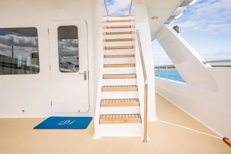 Slide: The Image of Staircase on 1996 Cheoy Lee 145 Global Series yacht, leading to upper deck. - 19