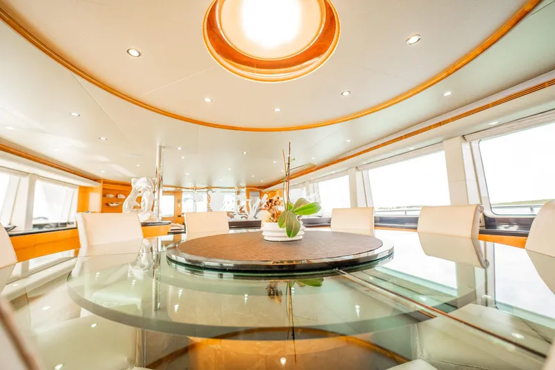 Slide: The Image of Luxurious dining area on 1996 Cheoy Lee 145 Global Series yacht, featuring elegant decor and panoramic windows. - 28