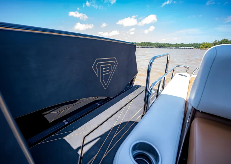 Slide: The Image of 2025 Paradigm 236 boat interior with sleek design and lake view. - 16