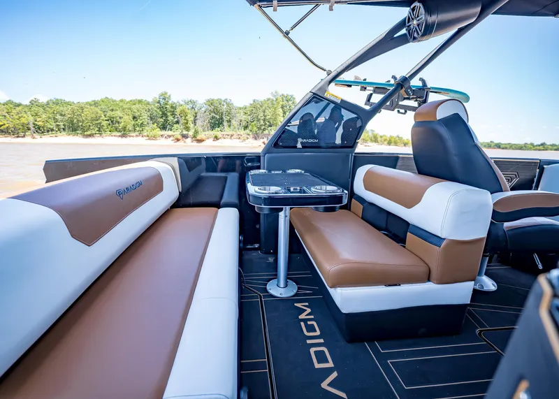 Slide: The Image of Luxurious interior of 2025 Paradigm 236 boat with stylish seating and table. - 17