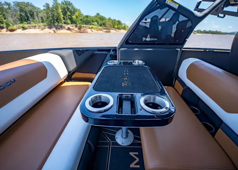 Slide: The Image of Luxurious interior of 2025 Paradigm 236 boat with sleek seating and modern table design. - 19