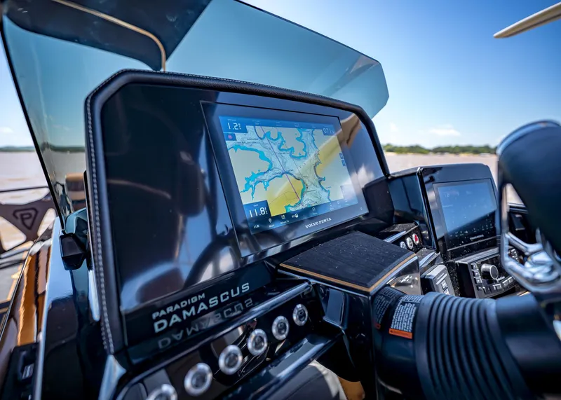 Slide: The Image of High-tech dashboard of 2025 Paradigm 236 boat with navigation display. - 26
