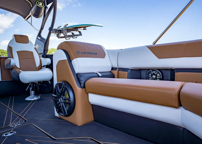 Slide: The Image of Luxurious interior of 2025 Paradigm 236 boat with brown and white seating. - 37