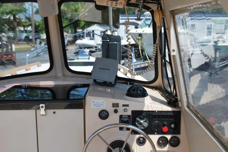 Slide: The Image of Interior view of 2001 Atlas Boat Works Pompano 21 cockpit with Garmin navigation system. - 11