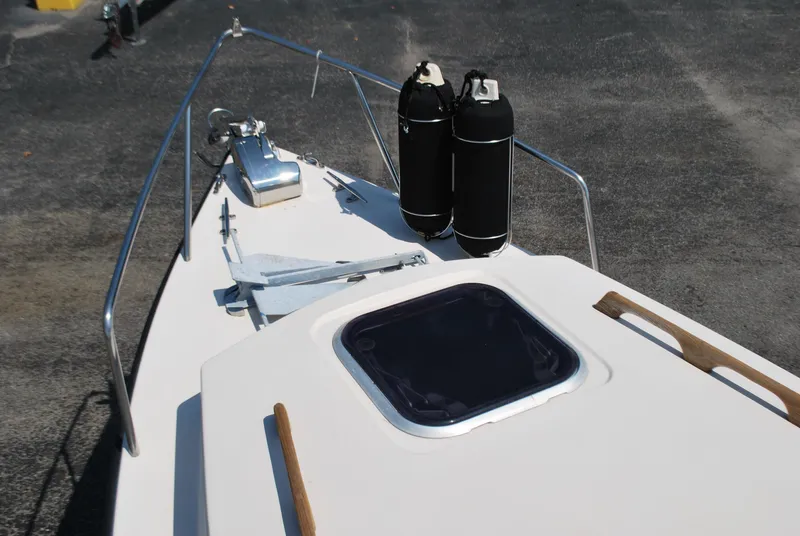 Slide: The Image of 2001 Atlas Boat Works Pompano 21 deck with anchor and hatch. - 12