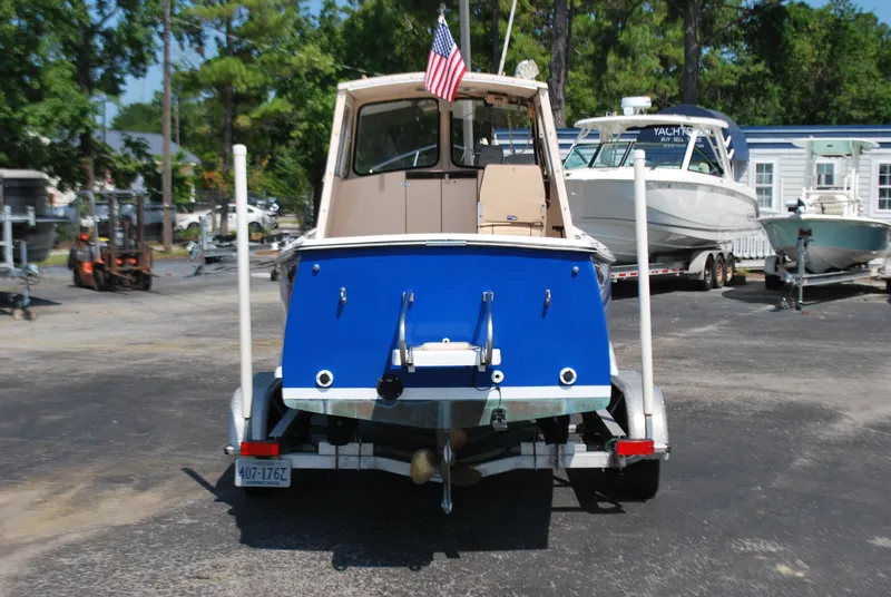 Slide: The Image of 2001 Atlas Boat Works Pompano 21 on trailer, rear view with American flag. - 4