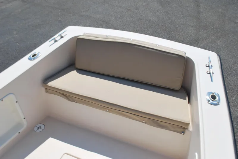 Slide: The Image of Atlas Boat Works Pompano 21, 2001 model, featuring beige cushioned seating on deck. - 6