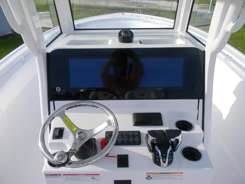Slide: The Image of 2026 Sportsman Open 252 Center Console dashboard with steering wheel and navigation display. - 13
