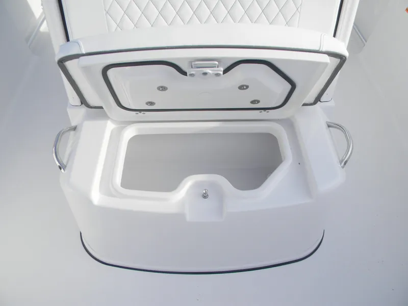 Slide: The Image of 2026 Sportsman Open 252 Center Console storage compartment with open lid, featuring sleek design. - 9