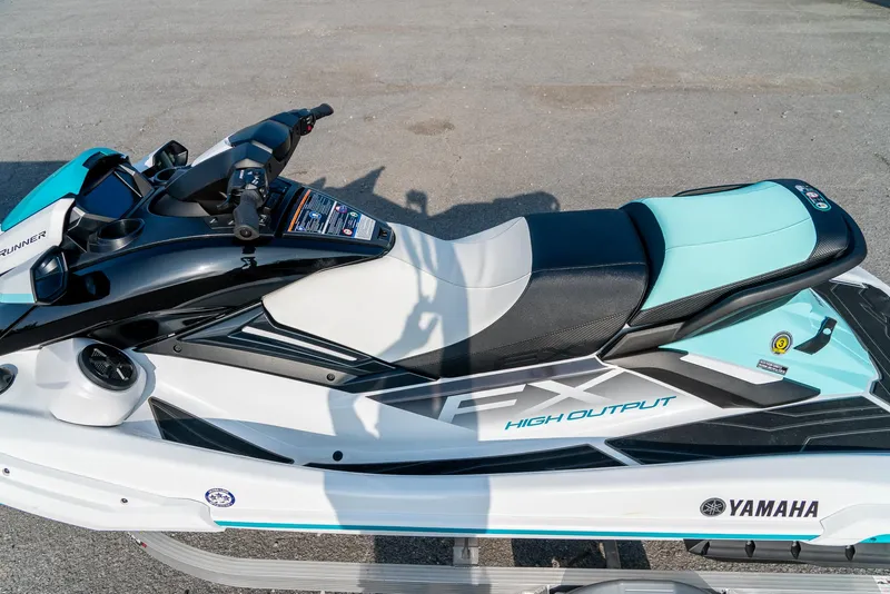 Slide: The Image of 2024 Yamaha WaveRunner FX Cruiser HO Audio, sleek design, high output, black and teal accents. - 4