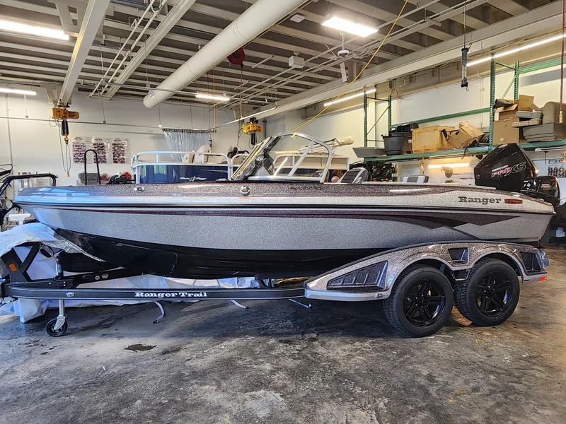 The Image of 2025 Ranger 1880MS boat in a garage, on a Ranger Trail trailer. - 0