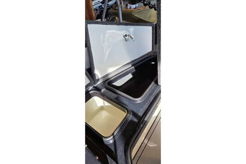 Slide: The Image of Open storage compartment in 2025 Ranger 1880MS boat, showcasing interior design and functionality. - 15