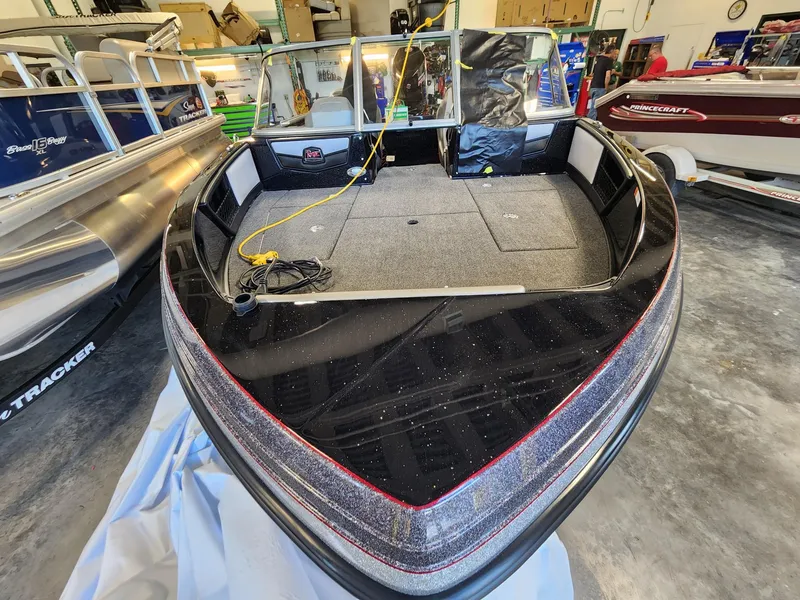 Slide: The Image of 2025 Ranger 1880MS boat in showroom, featuring spacious deck and modern design. - 5