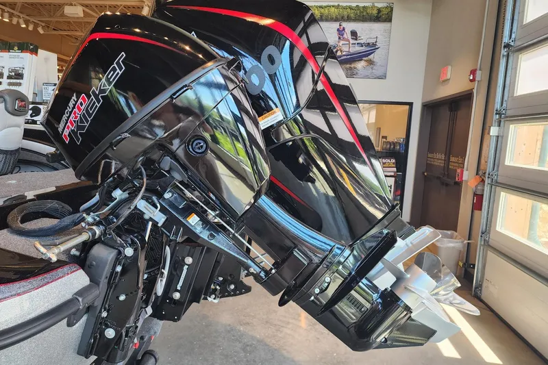 Slide: The Image of 2025 Ranger 1880MS boat with Mercury Pro Kicker outboard motor in showroom. - 4