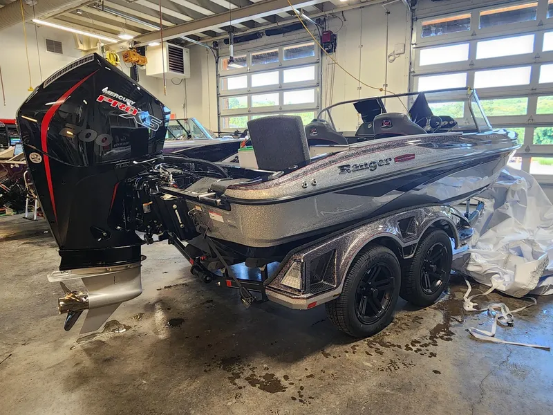 Slide: The Image of 2025 Ranger 1880MS boat with Mercury Pro XS engine in a garage setting. - 6